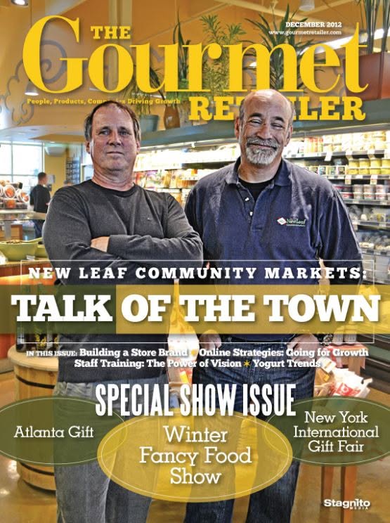 Front cover of The Gourmet Reviewer magazine, December 2012 issue, featuring two men standing in a grocery store aisle with large promotional text across the cover.