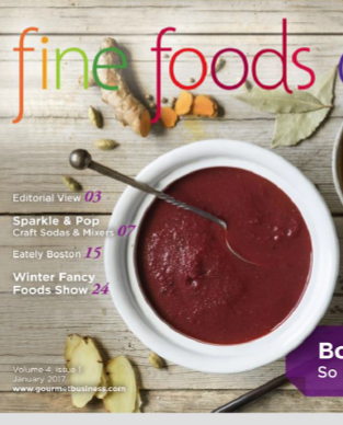Magazine cover with a bowl of red soup, ingredients, and text about food events.
