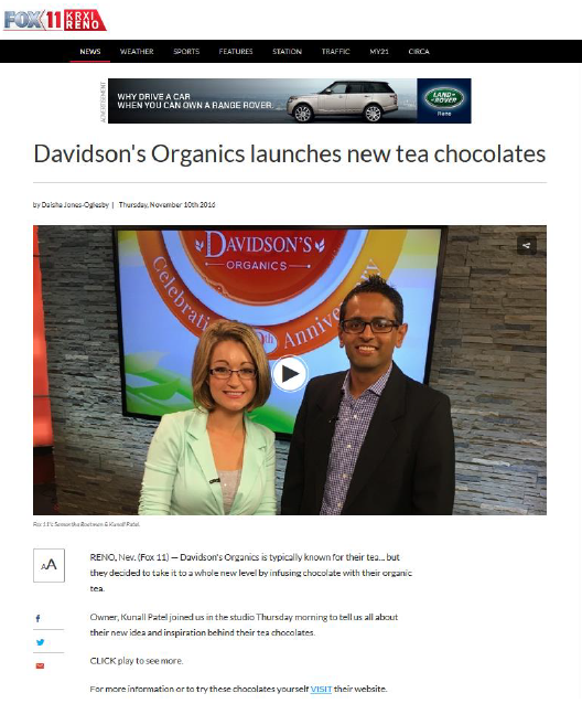 News article about Davidson's Organics launching new tea chocolates with a TV screen in the background.